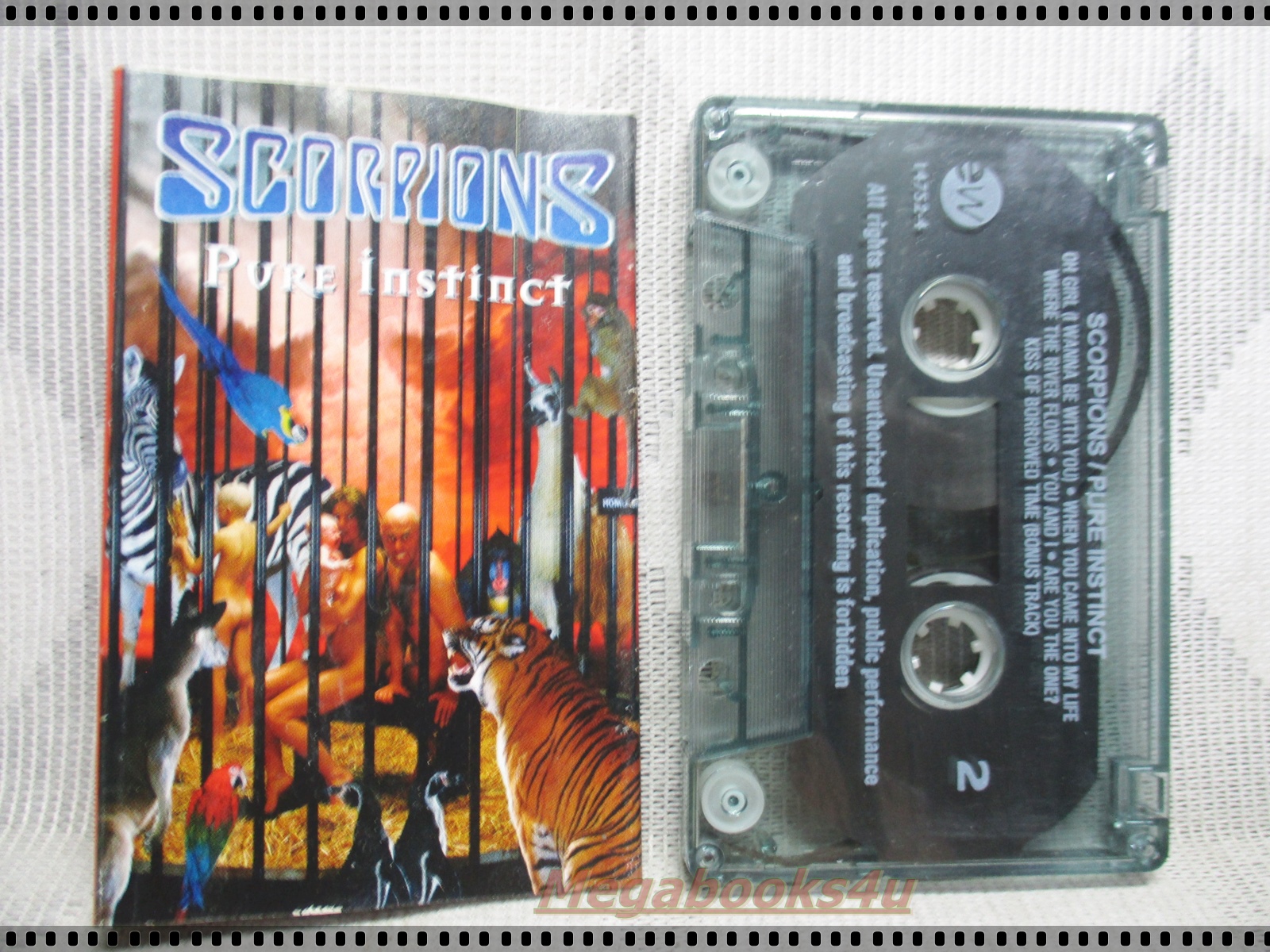 ขายเทปเพลงเก่า SCORPIONS ; PURE INSTINCT กระดาษแผ่นพับด้านในติดกัน