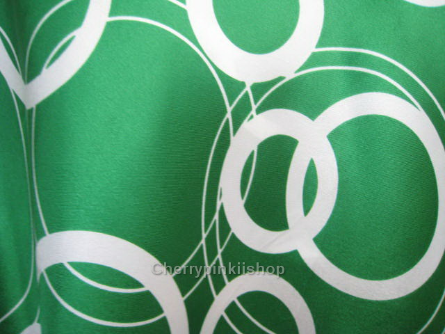 เสื้อแฟชั่นสีเขียวลายวงกลม สายเดี่ยว ผ้ามันลื่น นิ่ม สวยดูดี ผูกโบว์ที่ต้นคอด้านหลัง Made in USA