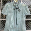 เสื้อแฟชั่นสีเขียวอ่อน ลาย Polka dot ลายจุด ผูกโบว์ที่ด้านหน้า เนื้อผ้าบางสวมใส่สบาย ยี่ห้อ Karen