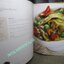 หนังสือ วิธีการปรุงอาหารไทยของดุสิต “Thai Way of Life, The Dusit Cookbook” (ปกแข็ง) ตำหนิ ตัวหนังสือมีคราบน้ำ กระดาษไม่ติด เปิดได้ตามปกติ